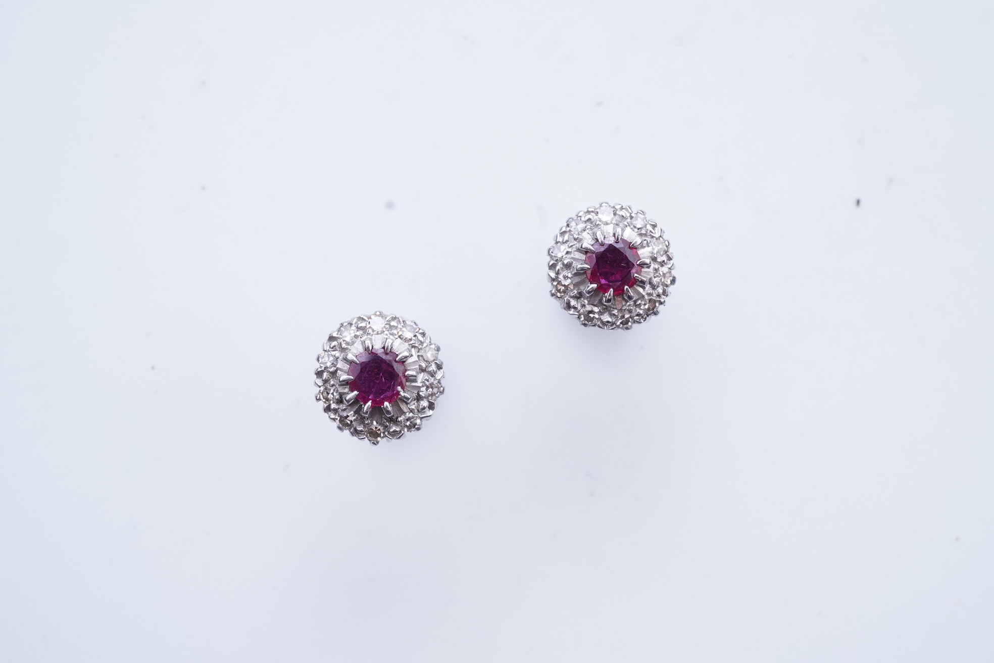 A pair of ruby and diamond earrings